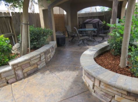 this is an image of a stamped patio and garden box project in corona, ca